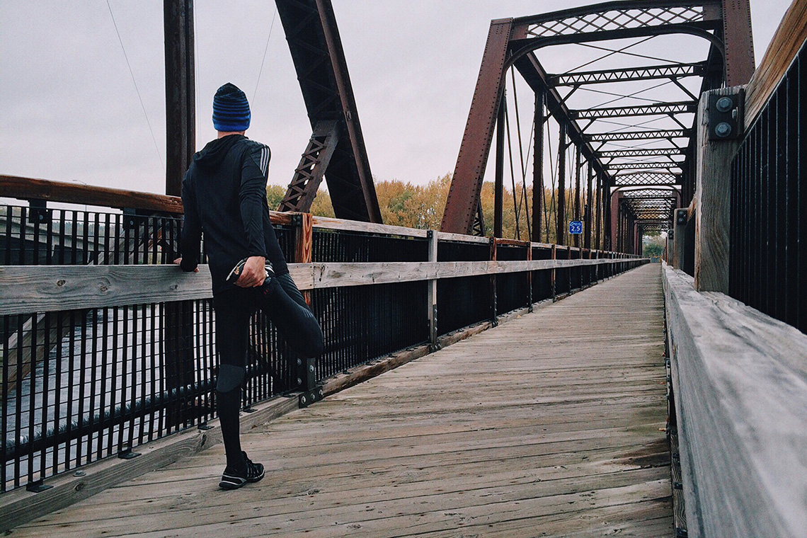 Runner streching quad muscle